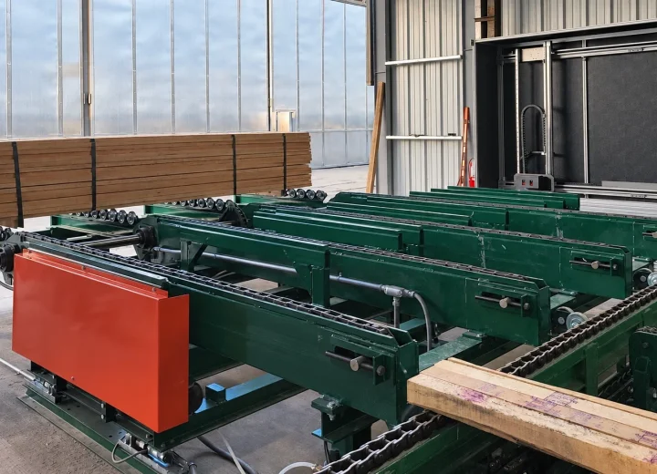 Close view of a VisionTallyHD scanner integrated with a chain-feed conveyor